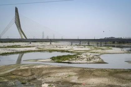 Delhi Water Crisis: Workers creating water channel in Yamuna riverbed