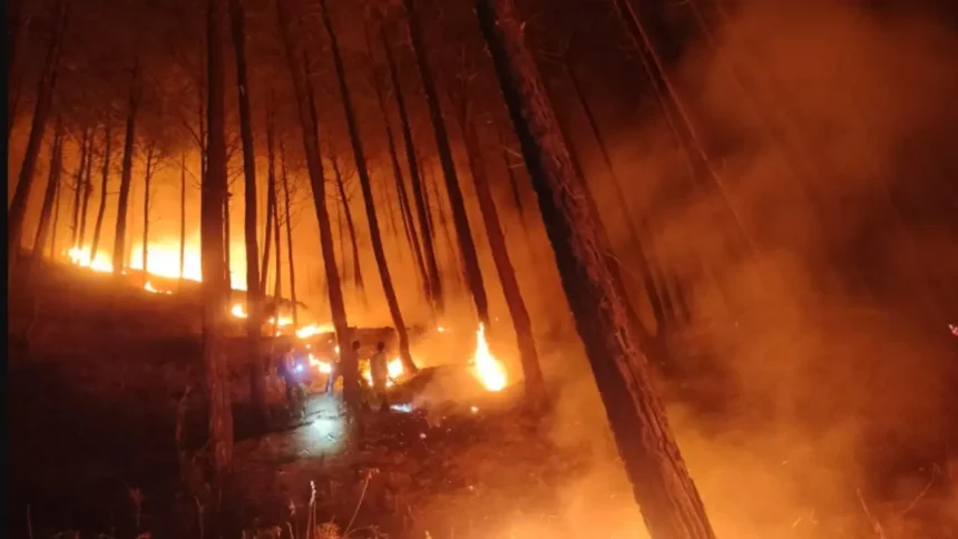 Uttarkashi Fire Incident tin shed colony after short circuit as firefighters try to control flames.