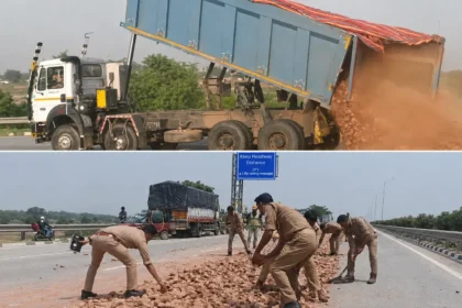 Eastern Peripheral Brick Spill: Police and JCB machine clearing bricks and stones from the Eastern Peripheral Expressway after an overloaded dumper caused a major road hazard near Greater Noida.