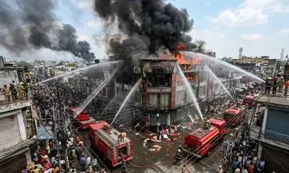 Paltan Bazaar Fire: Firefighters extinguishing a massive blaze at a saree and lehenga showroom during the incident in Dehradun.