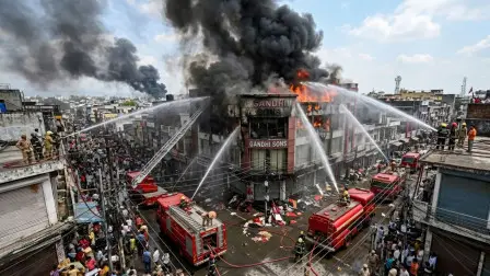 Paltan Bazaar Fire: Firefighters extinguishing a massive blaze at a saree and lehenga showroom during the incident in Dehradun.