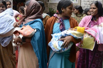 Uttarakhand NFHS Report 2026: Health workers checking pregnant women and children during maternal and child healthcare survey.