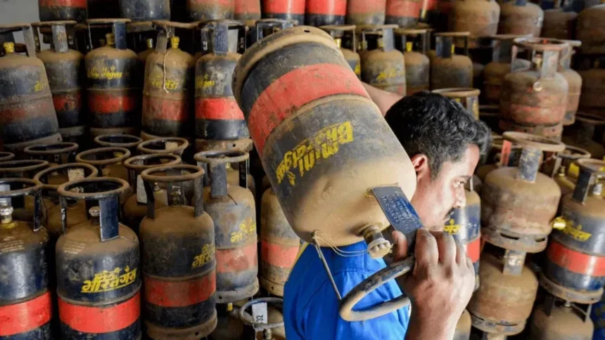 LPG Price Hike 2026: Commercial 19 kg LPG gas cylinders stacked at a distribution center after major hike.
