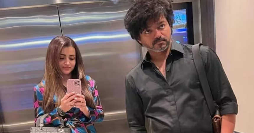 Trisha Krishnan and Thalapathy Vijay posing together during Vijay's 52nd birthday celebration, sparking discussion among fans about their friendship and public appearances.