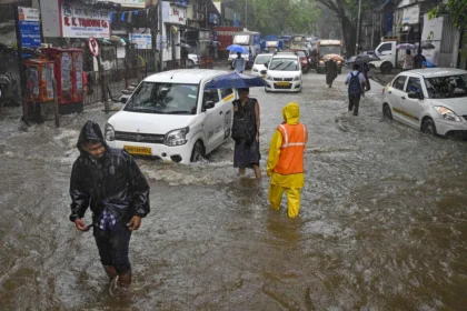 Mumbai Rain Chaos: Waterlogged roads and flooded railway tracks during Mumbai Rain Chaos after heavy monsoon rainfall.