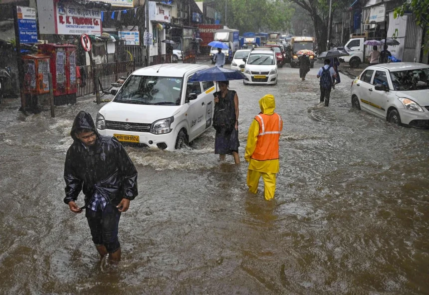 Mumbai Rain Chaos: Waterlogged roads and flooded railway tracks during Mumbai Rain Chaos after heavy monsoon rainfall.
