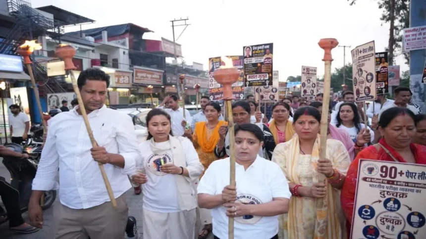 NEET Paper Leak Protest: Congress workers and students participate in the NEET Paper Leak Protest candle march for Riya Thapa in Dehradun, demanding justice and transparent examination reforms.
